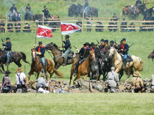 Civil War re-enactors portray a cavalry battle at the 150th Anniversary of the Battle of Gettysburg re-enactment on July 6. (Photo by Matt Phifer)